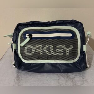 Gently used Oakley 90s Belt Bag for men. Dark blue& mint green color way